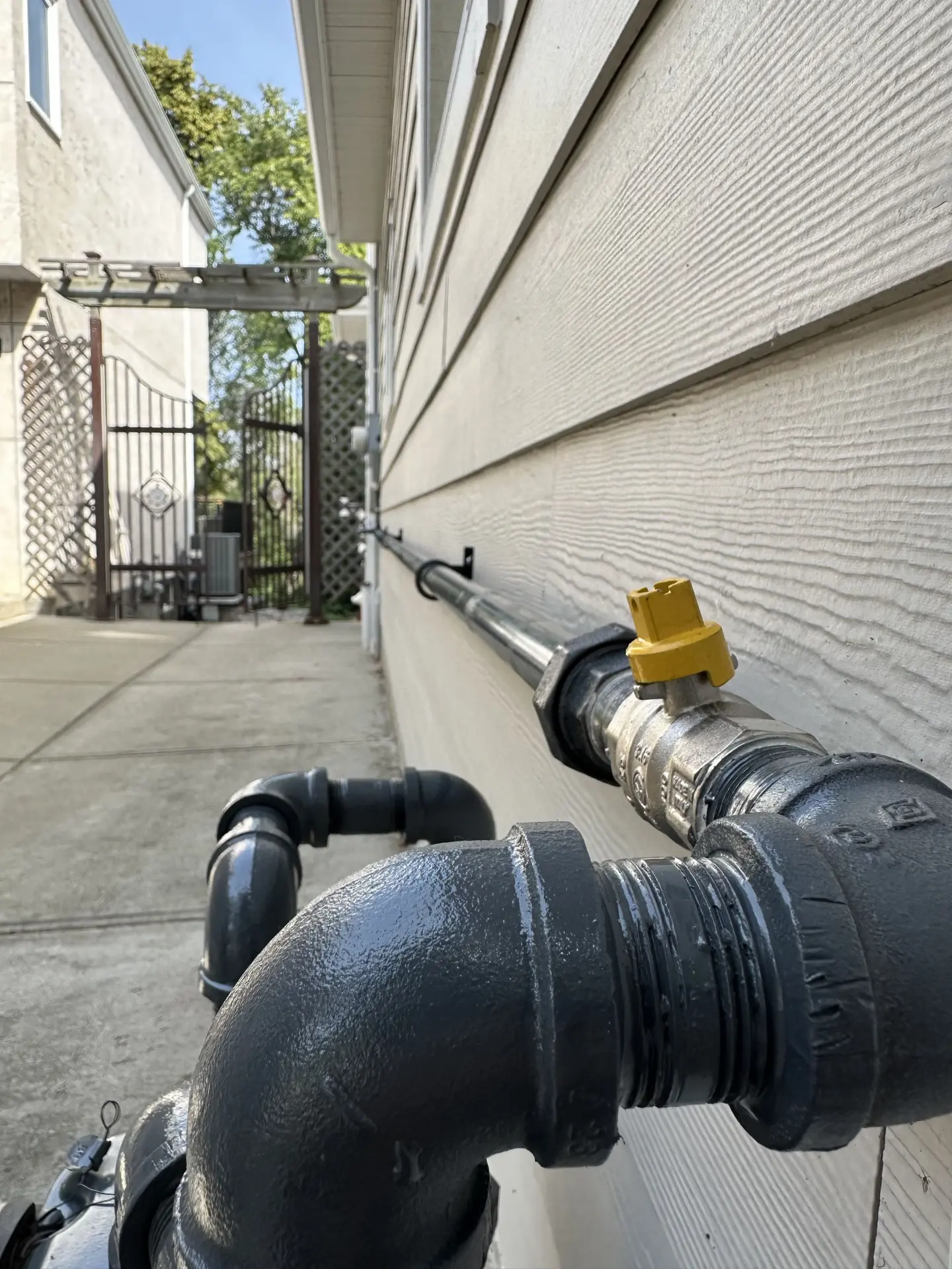 Professionally installed exterior natural gas line with shutoff valve